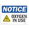 Signmission OSHA Notice, 5" Height, Oxygen In Use Sign With Symbol, 7" X 5", Landscape OS-NS-D-57-L-17097 - alternate 1